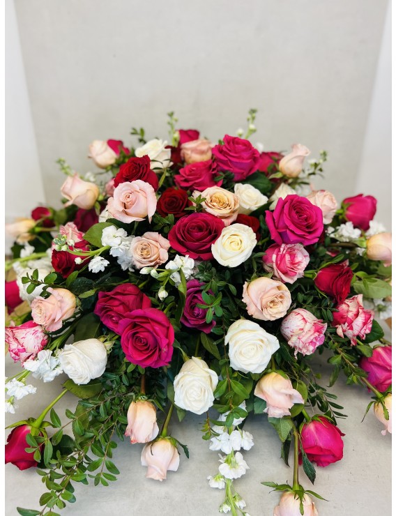 SHADES OF PINK ROSES AND MIX CASKET SPRAY